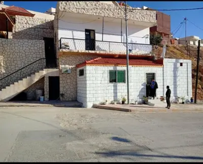 a man standing in front of a building at Idris home in Wadi Musa