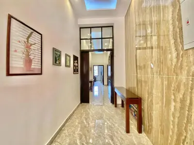 a hallway of a home with a table at Villa Mira Guesthouse 1 - Downtown Central Amman - AL DIYRIH in Amman