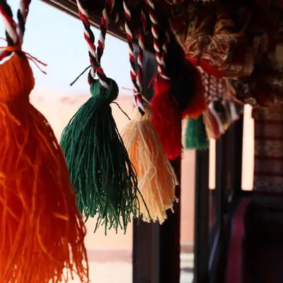 a group of tassels hanging from a window at Desert Bedouin camp in Wadi Rum