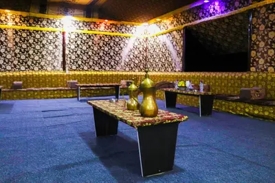a room with a table with a vase on it at Discover the life of Wadi Rum camp in Wadi Rum