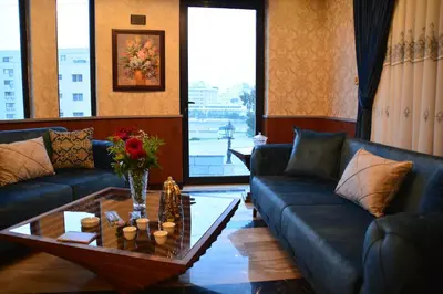 a living room with couches and a coffee table at سما عمان للشقق الفندقية Sama Amman Hotel Apartments in Amman