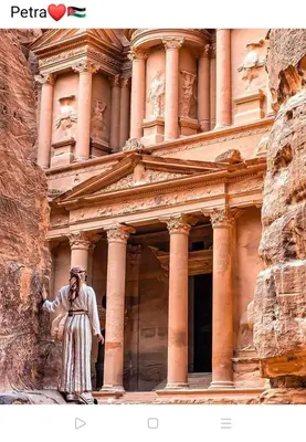 a man standing in front of a building at Petra Monastery Tourist Hotel in Wadi Musa