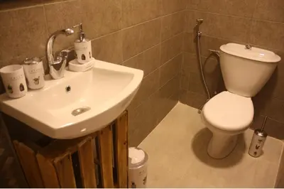 a bathroom with a toilet and a sink at Petra Main Gate in Wadi Musa