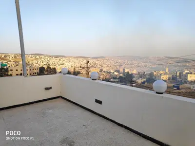 a view of the city from the roof of a building at The Pearl of Jerash in Jerash