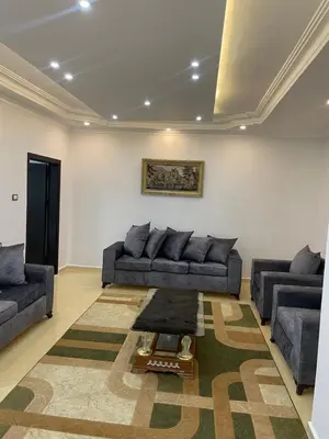 a living room with two couches and a table at Oskar Appartment 2 in Wadi Musa