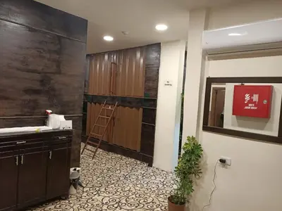 a bathroom with a ladder and a cabinet in a room at PETRA Cabin Dorms Hostel in Wadi Musa