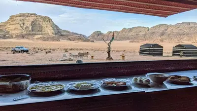 a buffet of food on a table in the desert at Wadi rum galaxy camp in Wadi Rum