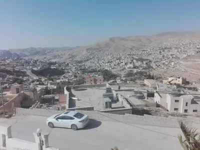 a white car parked on top of a city at Horizon in Wadi Musa