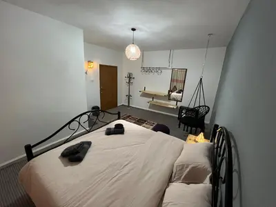 a bedroom with a bed with two towels on it at Euphoria guest house in Wadi Musa