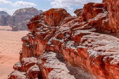 a canyon in the desert with mountains in the background at Arena Desert Camp & Adventurers in Wadi Rum