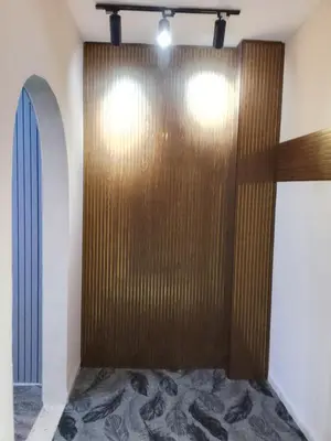 a large wooden door in a room at Bubble castle in Kerak