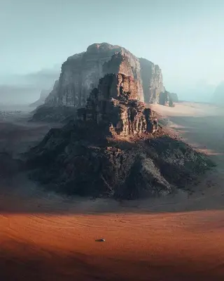an island in the middle of a desert with a mountain at Wadi Rum in Wadi Rum