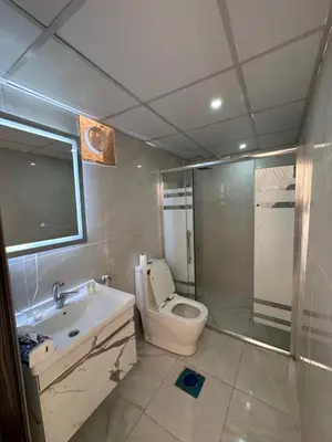 a bathroom with a toilet and a sink and a shower at Amanda Luxury Camp in Wadi Rum