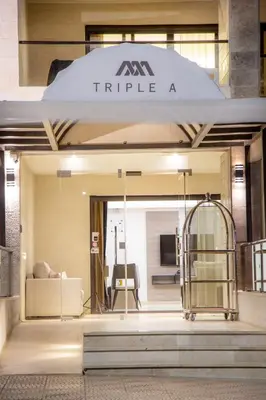 a store front with a large window with a couch at Triple A Hotel Suites in Amman