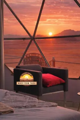 a view of the sunset from a boat at WADI RUM TARA lUXURY CAMP in Wadi Rum