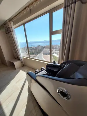 a room with a bed and a large window at Jordan Seasons Hotel in Aqaba