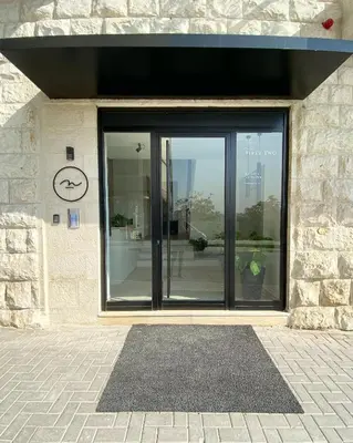 a building with a window with a clock on it at Nu Fifty Two in Amman