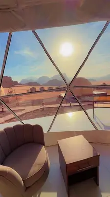 a living room with a couch and a table at NAEL BEDOUIN lUXURY CAMP in Wadi Rum