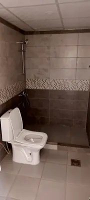 a bathroom with a toilet and a shower at Wadi Rum Marcanã camp in Aqaba