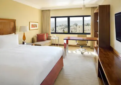 a hotel room with a bed and a desk at InterContinental Amman Jordan by IHG in Amman