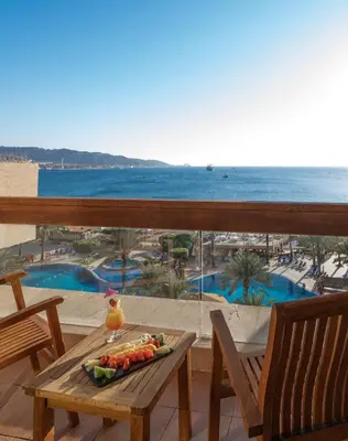 a tray of vegetables on a table on a balcony at InterContinental Aqaba by IHG in Aqaba