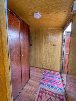 a room with a door and a rug on the floor at Rum Oasis Luxury Camp in Wadi Rum