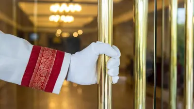 a hand in a santa suit holding a mirror at Kempinski Hotel Ishtar Dead Sea in Sowayma