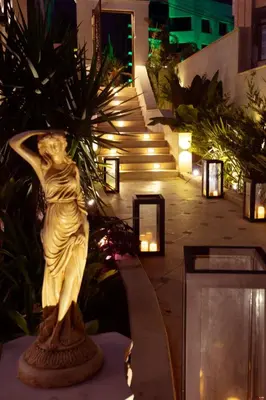 a statue of a woman in a building with lights at Seas Hotel Amman in Amman