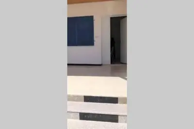 an empty room with a door and a hallway at Gedara Guesthouse: enjoy unforgettable scenes in Um Qeis