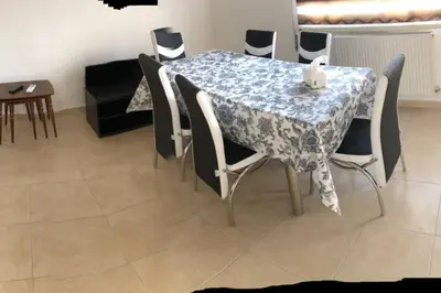 a dining room table and chairs with a blue and white table cloth at Apt 4 rent/A quiet neighborhood close to services in Amman