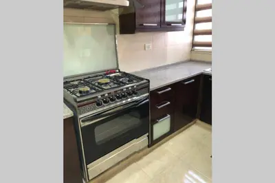 a kitchen with a stove top oven in a kitchen at Apt 4 rent/A quiet neighborhood close to services in Amman