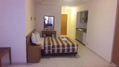 a hotel room with a bed and a mirror at Razan Hotel in Amman