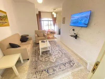 a living room with a couch and a table at ROYAL Real ESTATE in Amman