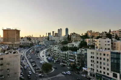 a view of a city with cars and buildings at Amazing one Bedroom Apartment in Amman Elwebdah 3 in Amman