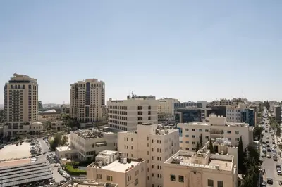 an aerial view of a city with tall buildings at Sheraton Amman Al Nabil Hotel in Amman
