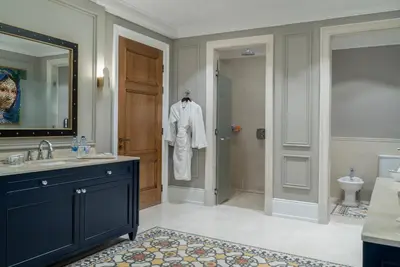 a bathroom with a sink and a mirror at Landmark Amman Hotel & Conference Center in Amman