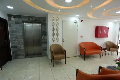 a waiting room with two chairs and a waiting room at Downtown Hotel للعائلات فقط in Aqaba
