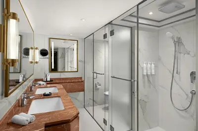 a bathroom with a sink and a shower at Amman Marriott Hotel in Amman