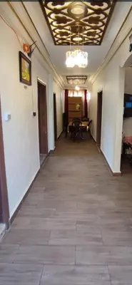 an empty hallway in a building with a ceiling at the prince apartment شقة الامير in Wadi Musa