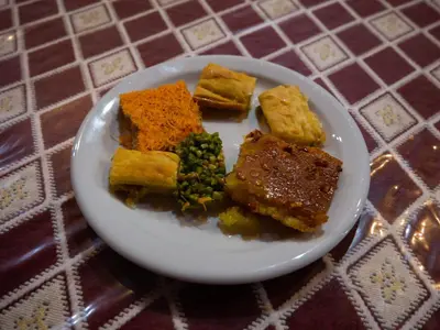 a white plate of food on a table at Wadi Rum Nights in Wadi Rum