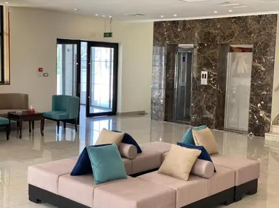 a living room with a couch in a lobby at Jordan View Hotel in Amman