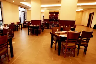 a dining room with tables and chairs in a restaurant at Baity Boutique Hotel in Aqaba