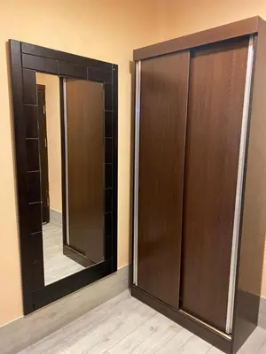 a closet with a mirror in a room at Al-Naher Al-Khaled Hotel in Aqaba