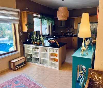 a kitchen with a counter with plants on it at The Precious Villa in Sowayma