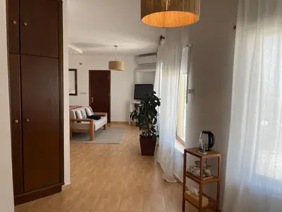 a hallway with a living room with a couch at The Precious Villa in Sowayma