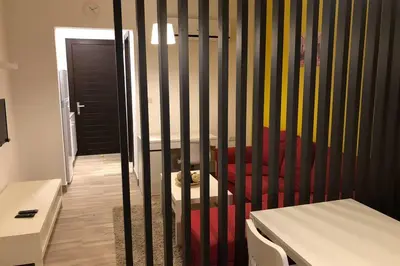 a room with a crib with a dog in it at My Cosy little place in Amman