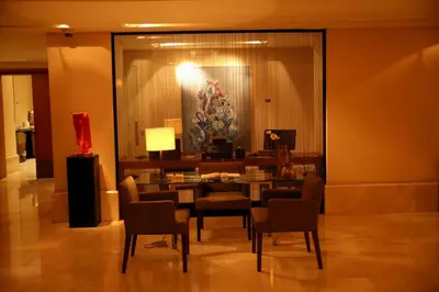 a dining room with a table and chairs at AlQasr Metropole Hotel in Amman