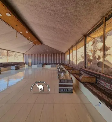 a large room with a museum with paintings on the walls at White Desert Camp in Wadi Rum
