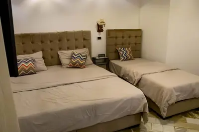 two beds in a room with two beds sidx sidx sidx at Celestia Boutique Inn in Jerash