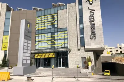 a building with a sign on the side of it at Luxury Apartment in Awesome Location in Amman in Amman